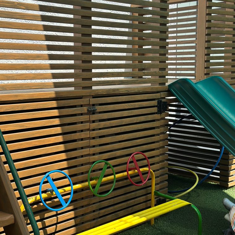 The outdoor play structure with colorful spinning wheels